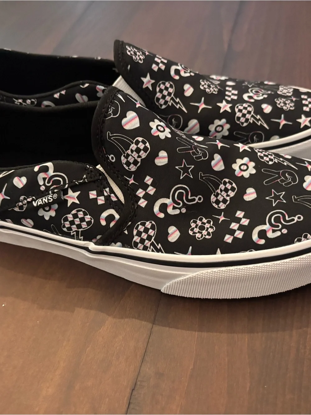 Vans Women’s Black Slip-On Sneakers with Multicolor Icon Accents